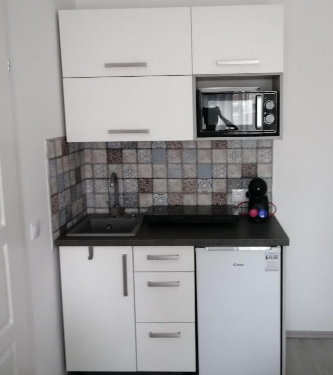 Kuchyň nebo kuchyňský kout v ubytování Werner Apartman