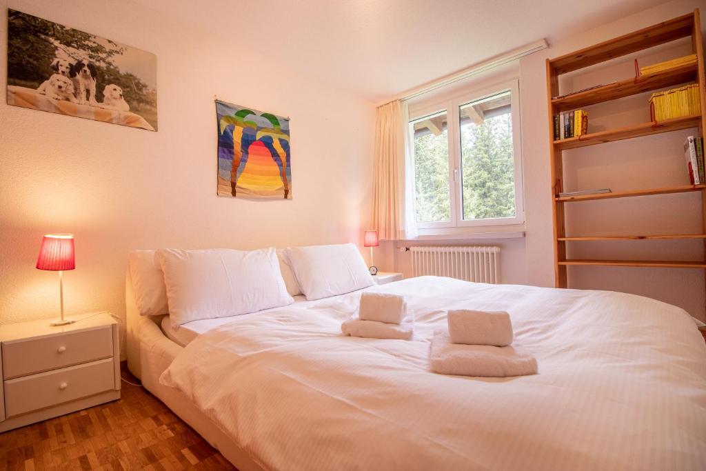 Postel nebo postele na pokoji v ubytování Latschüel by Arosa Vacations