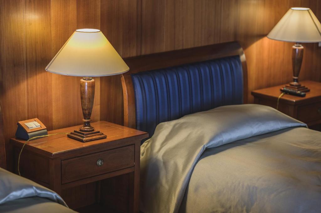 A bed or beds in a room at Le Camere di Palazzo Bortolan