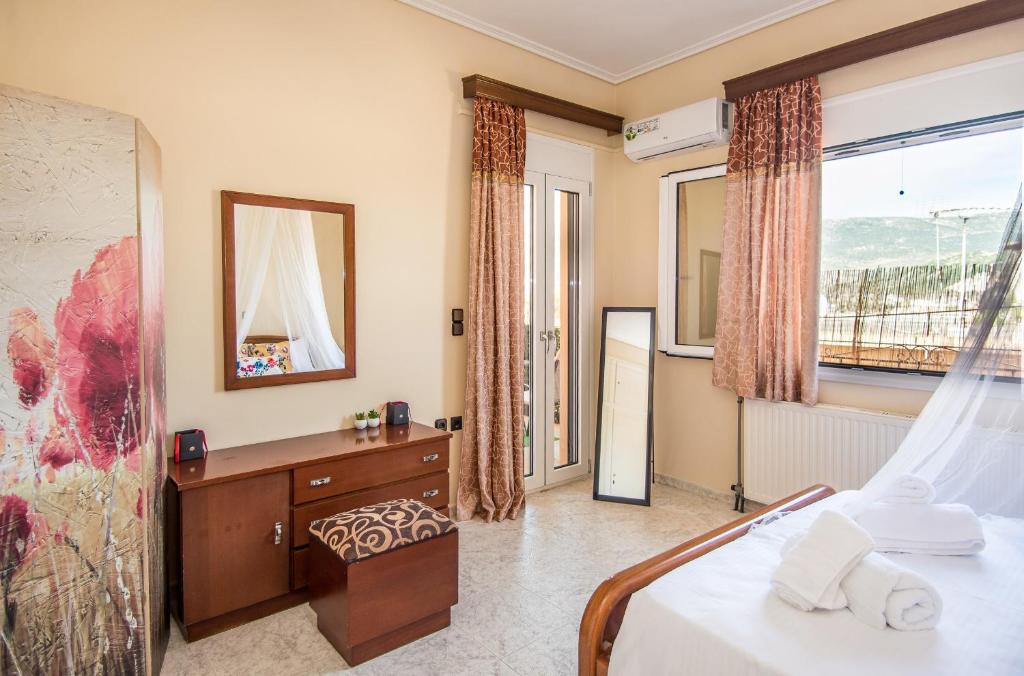 a hotel room with a bed and a window at STEFANOS HOUSE in Argostoli