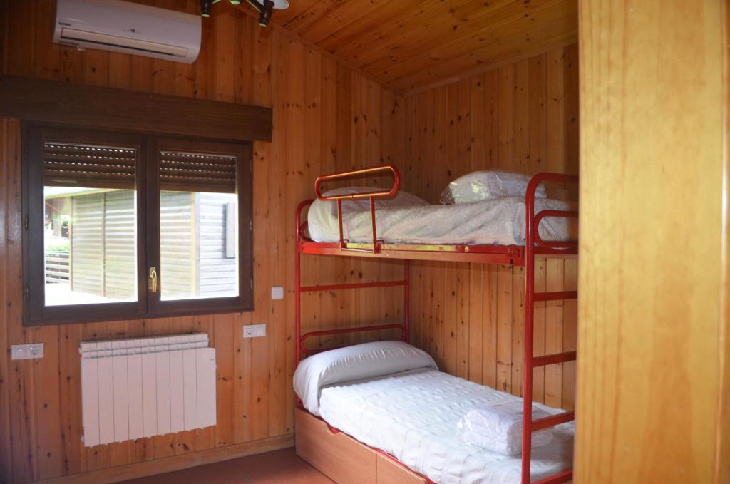 En eller flere senge i et værelse på Cabañas bungalow, El Bosque de los Sueños