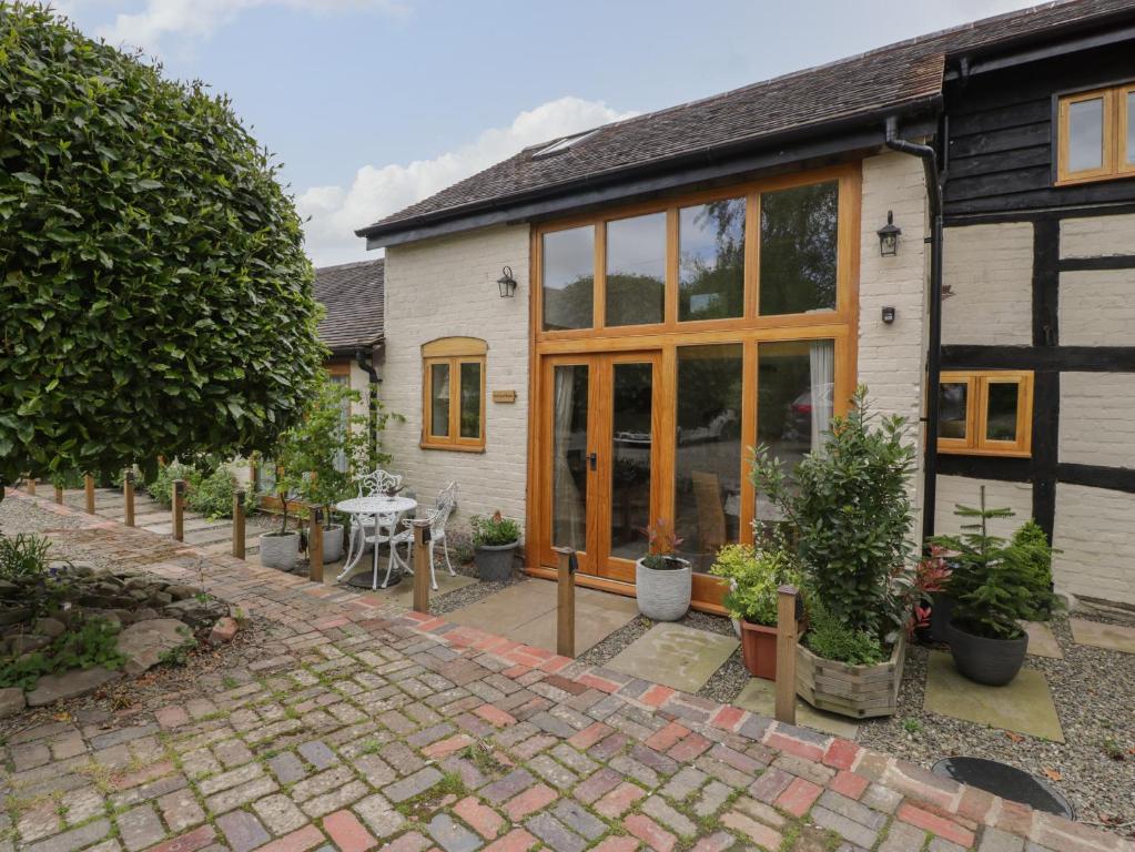 an internal view of a house with glass doors at The Cart Barn in Leominster