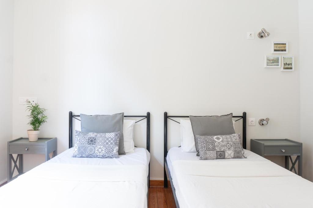Posteľ alebo postele v izbe v ubytovaní Dioskouros Hostel