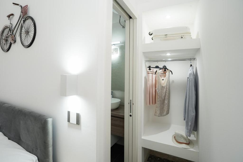 a bedroom with a closet with a bike in it at Meraviglia d'Otranto in Otranto