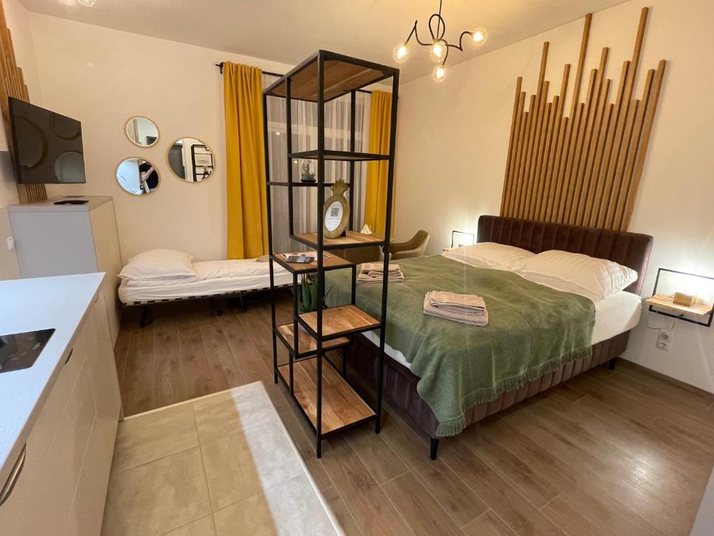 Posteľ alebo postele v izbe v ubytovaní Hillside Central Apartments