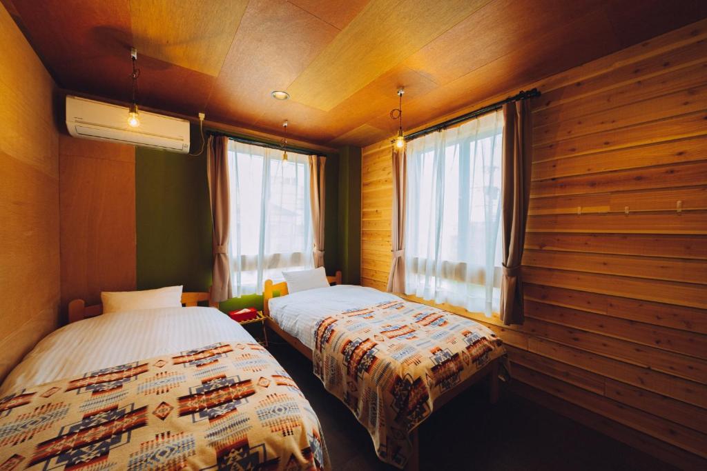 מיטה או מיטות בחדר ב-Noasobi Lodge 201- Vacation STAY 45770v