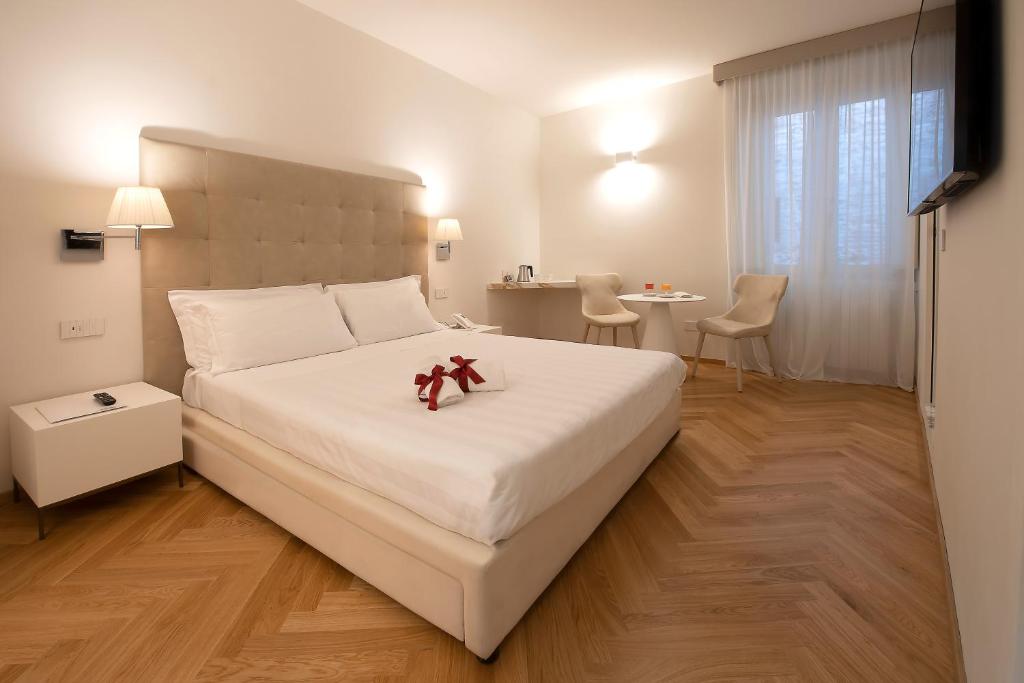 Łóżko lub łóżka w pokoju w obiekcie Asisium Boutique Hotel