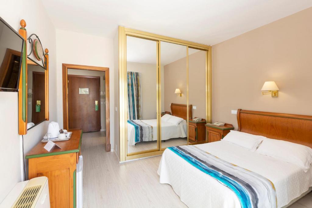 A bed or beds in a room at Mar Hotels Paguera & Spa