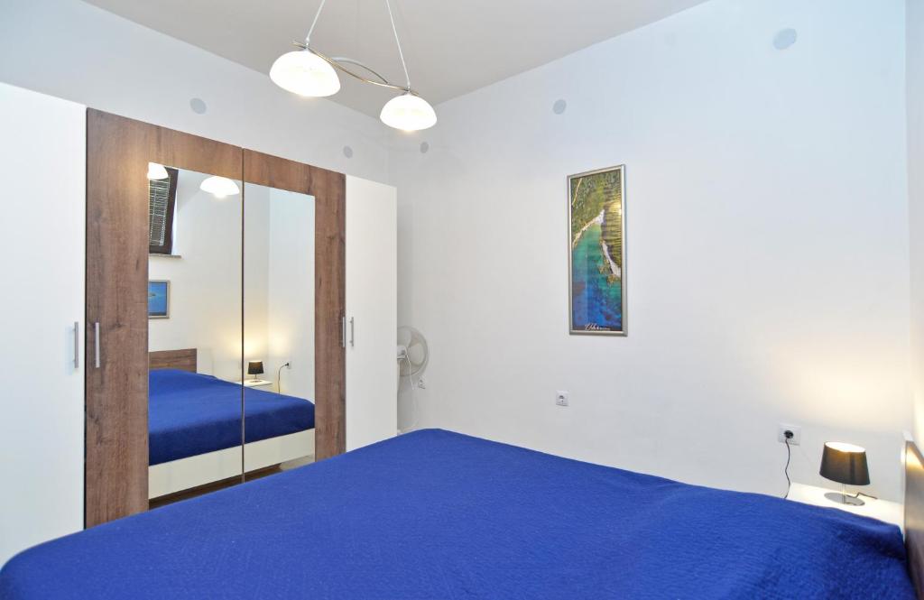 Postel nebo postele na pokoji v ubytování Apartments Branislav 1927
