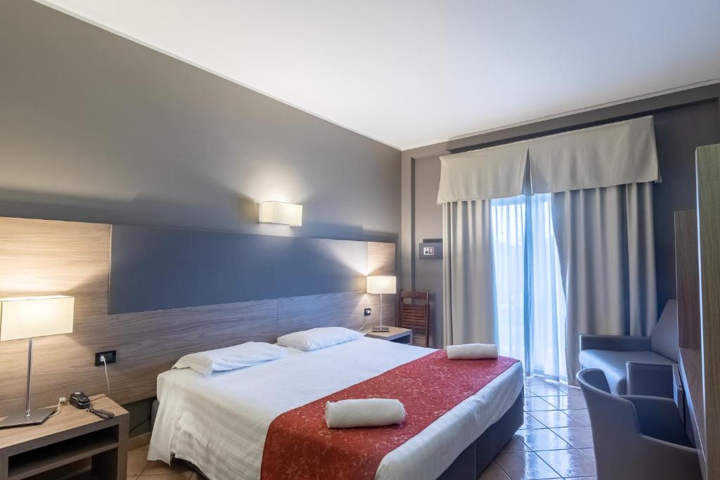 Postel nebo postele na pokoji v ubytování Hotel Sunflower