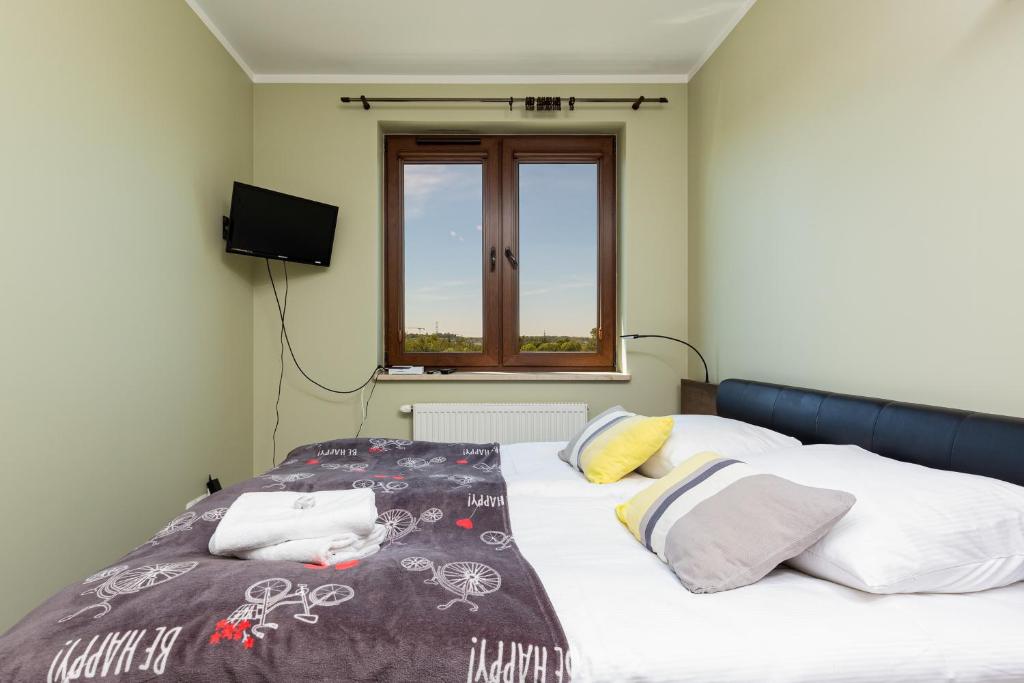 Posteľ alebo postele v izbe v ubytovaní Apartment Na Zakolu Wisły by Noclegi Renters
