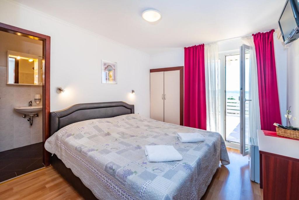 Postel nebo postele na pokoji v ubytování Villa Sunce