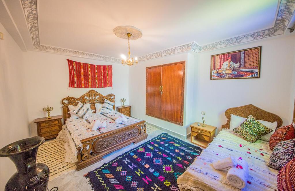 Postel nebo postele na pokoji v ubytování Riad Mahrez