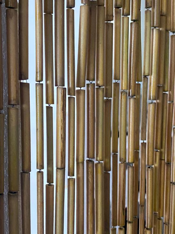 a close up of a building made of bamboo at Lou Mut in Lectoure