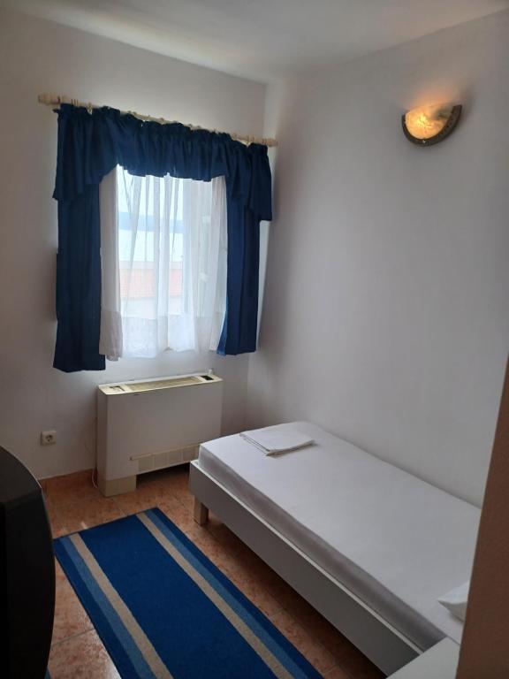 Postel nebo postele na pokoji v ubytování Hotel Ivan Dujmović Dvori