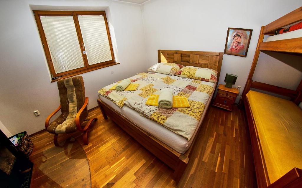 Postel nebo postele na pokoji v ubytování Apartmany pod Tatrami