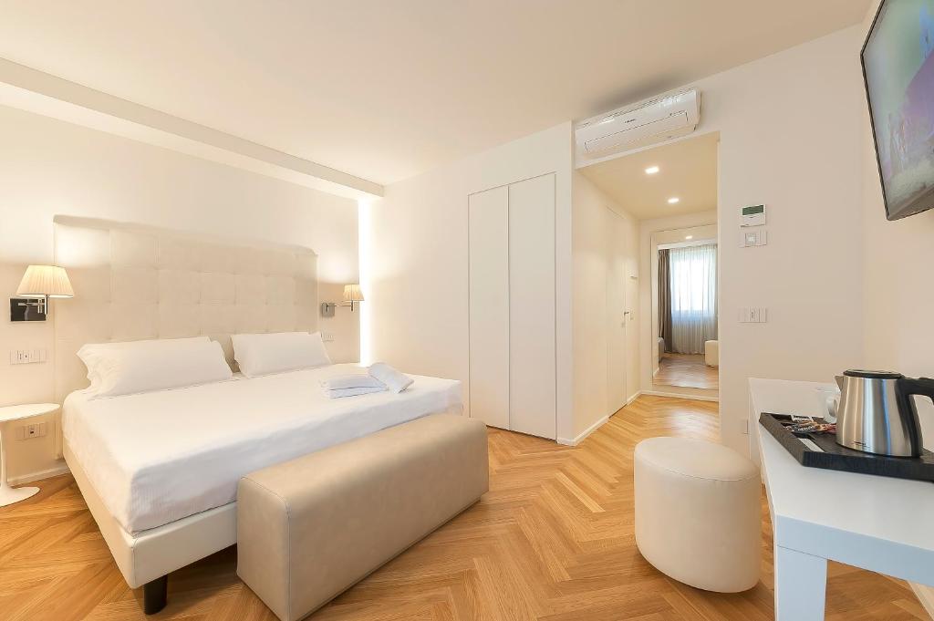 Łóżko lub łóżka w pokoju w obiekcie Asisium Boutique Hotel