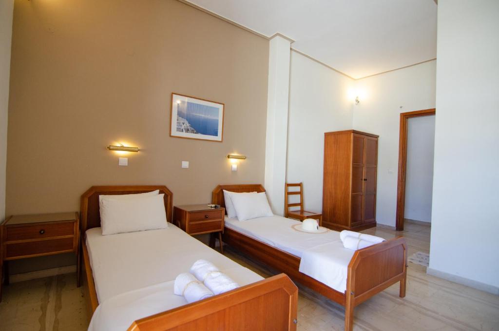 Postel nebo postele na pokoji v ubytování Almira Inn