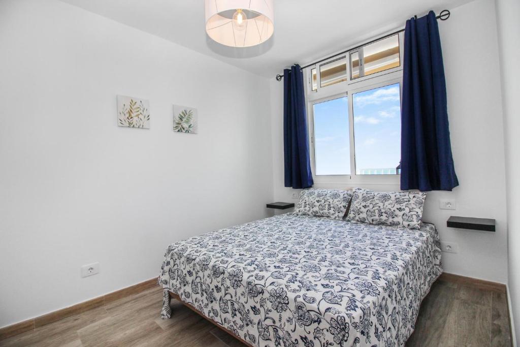 Tempat tidur dalam kamar di Amadores Top Views apartment