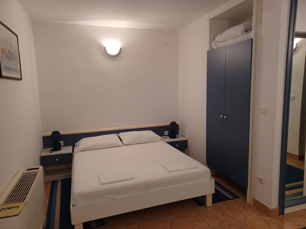 Postel nebo postele na pokoji v ubytování Hotel Ivan Dujmović Dvori