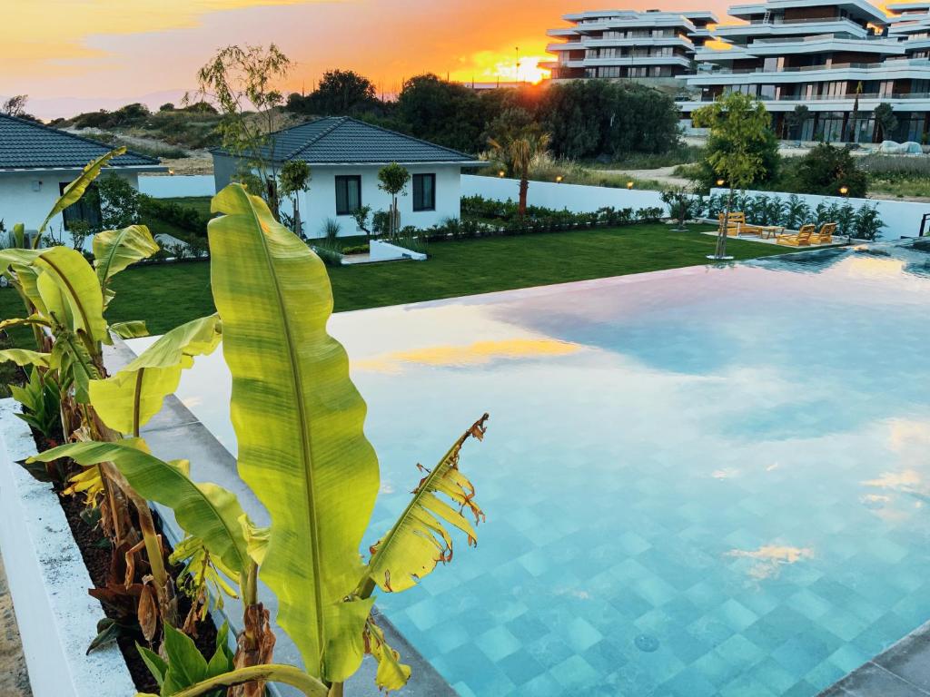 a view of a swimming pool in a resort at KADAGAN SUİTES AYASARANDA in Çeşme