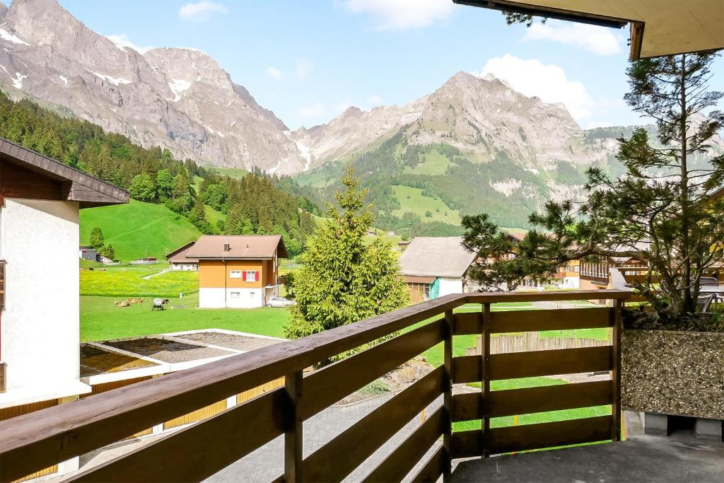 a balcony with a view of a mountain at Apartment next to Titlis Station in Engelberg
