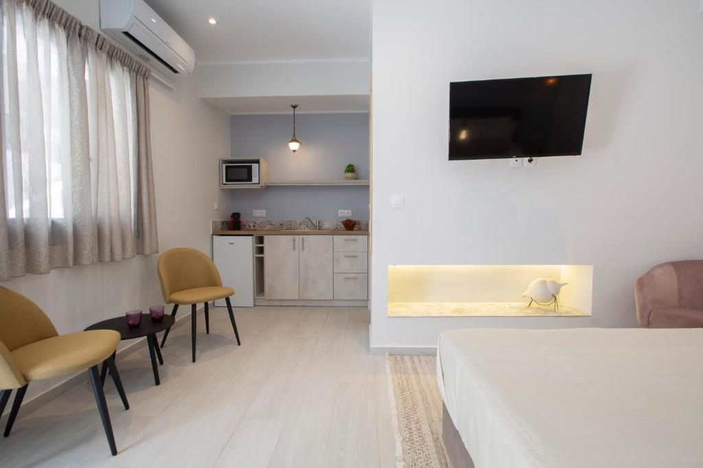 Televízia a/alebo spoločenská miestnosť v ubytovaní Edward Art Boutique Hotel