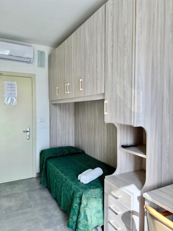 Postel nebo postele na pokoji v ubytování Hotel Terramare