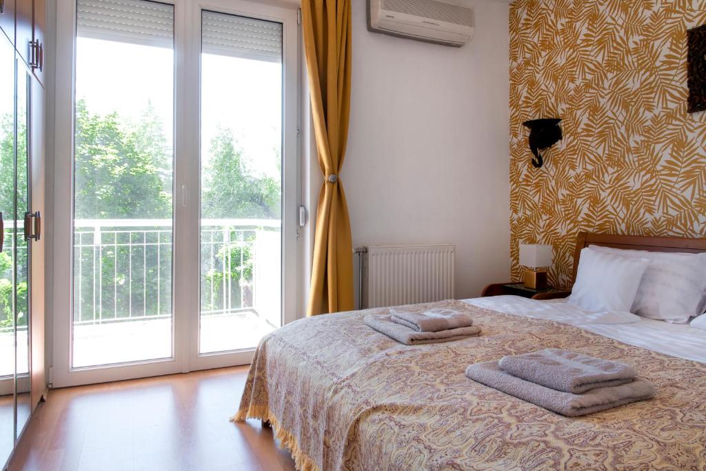 Posteľ alebo postele v izbe v ubytovaní Balaton Lakeside Residence