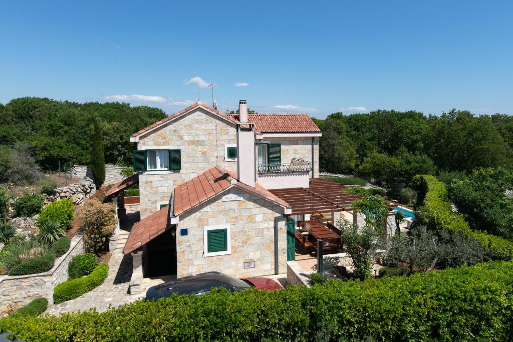 an aerial view of a house in a vineyard at Villa Luči in Pučišća