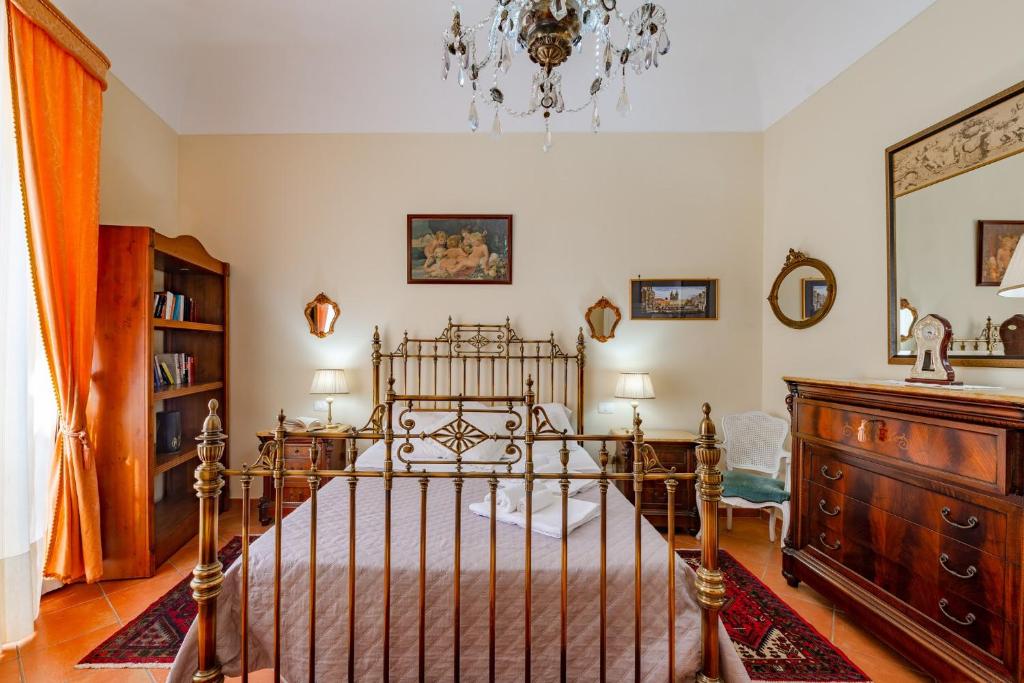 Posteľ alebo postele v izbe v ubytovaní La casa di Dante