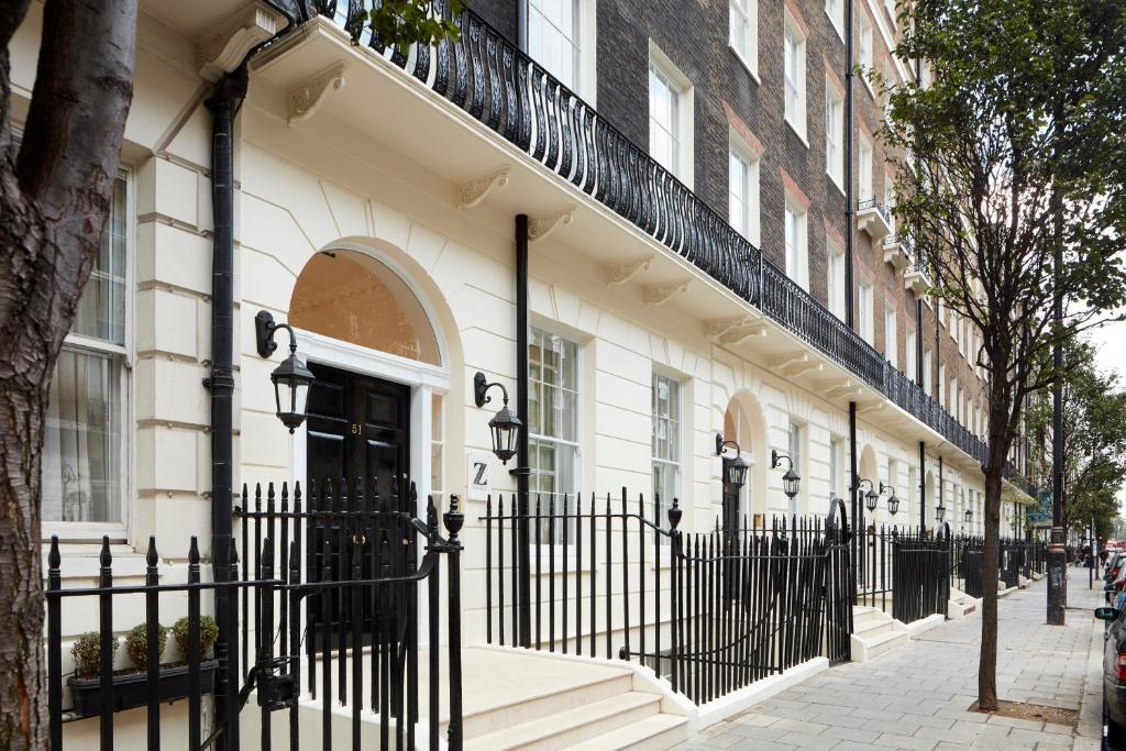 a black fence in front of a building at The Z Hotel Gloucester Place in London
