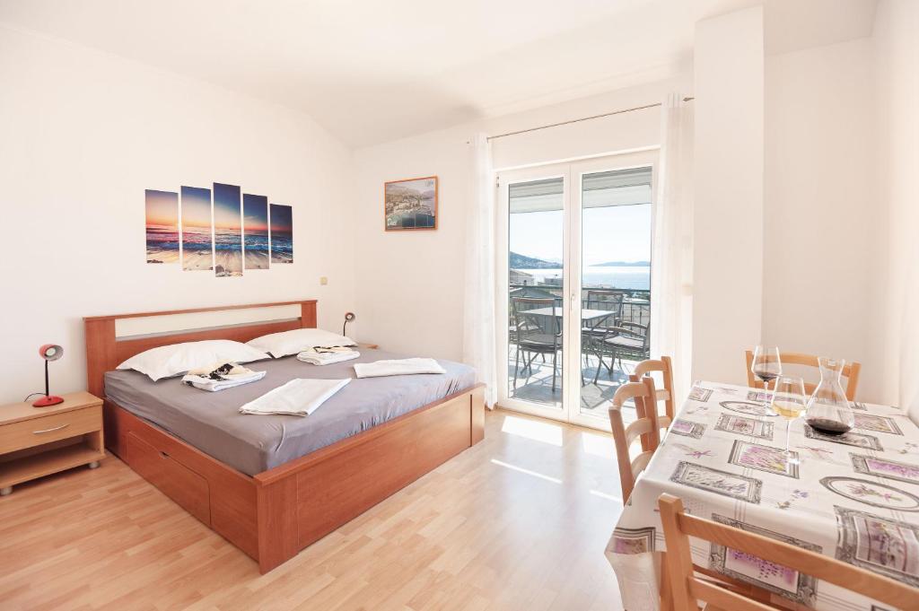 Posteľ alebo postele v izbe v ubytovaní Apartments Tomic