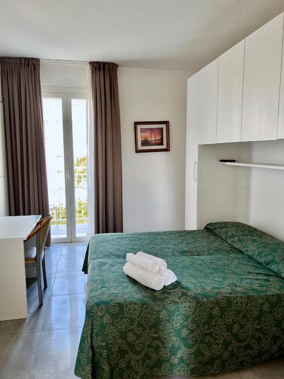 Postel nebo postele na pokoji v ubytování Hotel Terramare