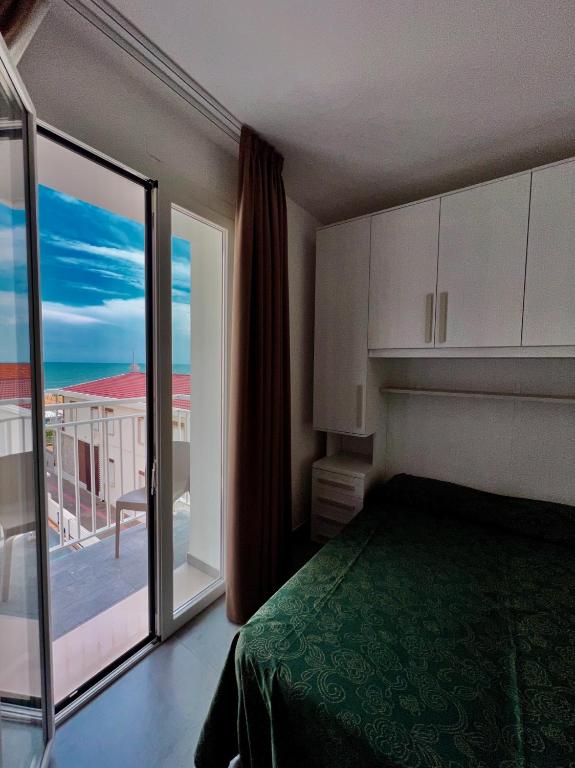 Postel nebo postele na pokoji v ubytování Hotel Terramare