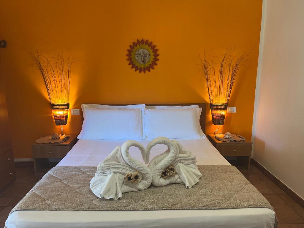 A bed or beds in a room at Tropea Casa Scirocco