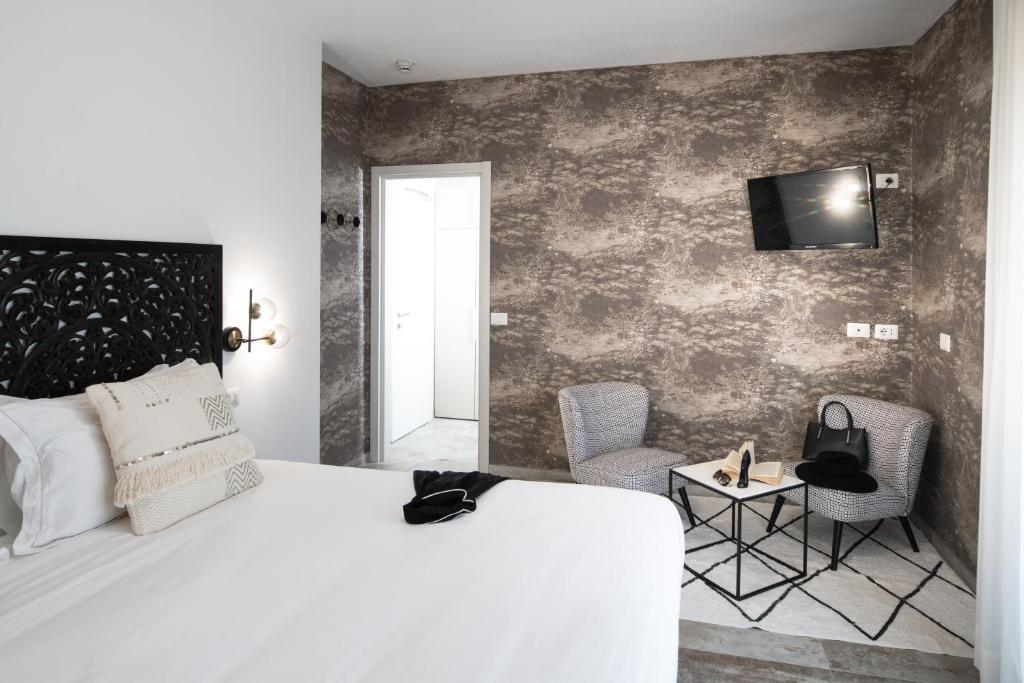 Postel nebo postele na pokoji v ubytování Hotel Brennero