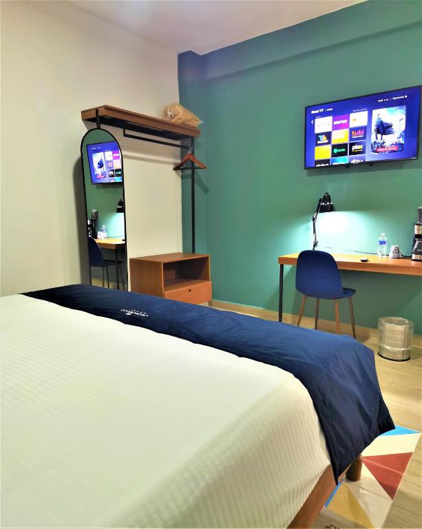 TV a/nebo společenská místnost v ubytování HOTEL CHURUMUCO