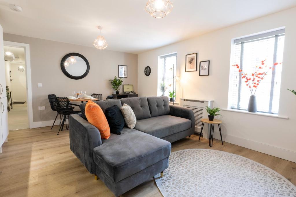 a living room with a couch and a table at The Courtyard in Southampton