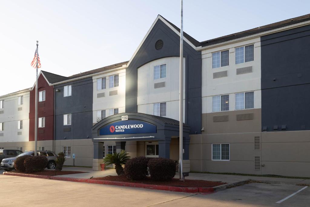 a rendering of the entrance to a hotel at Candlewood Suites Houston Westchase - Westheimer, an IHG Hotel in Houston