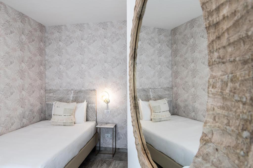 Postel nebo postele na pokoji v ubytování Hotel Brennero