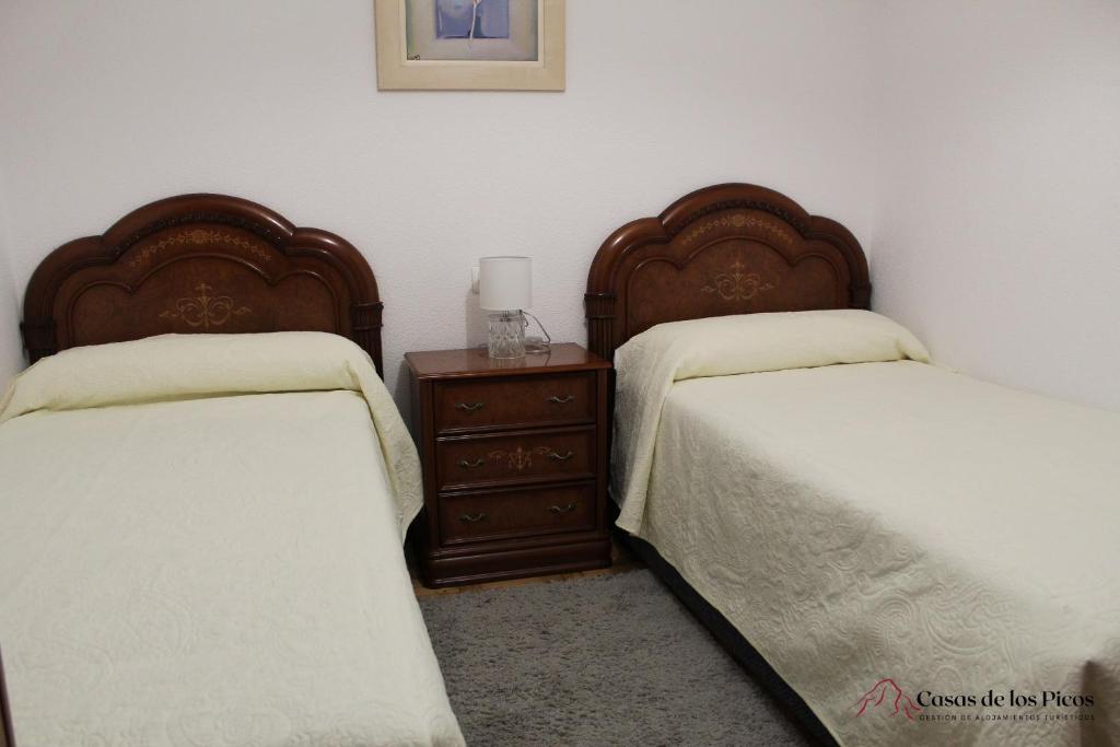 Postel nebo postele na pokoji v ubytování VUT La Fuentina -Casas de los Picos