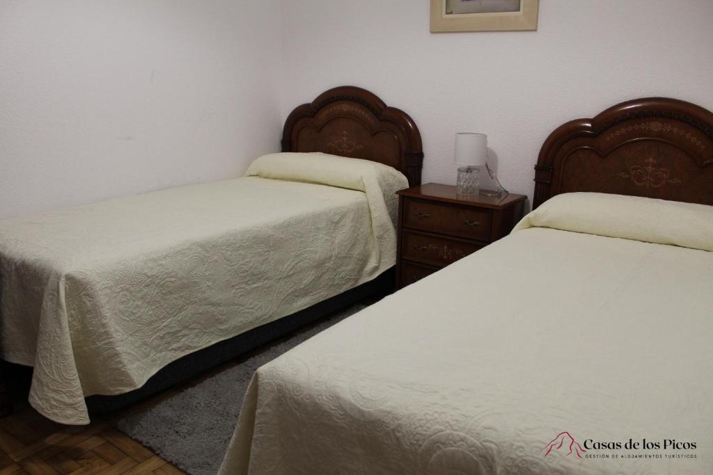 Postel nebo postele na pokoji v ubytování VUT La Fuentina -Casas de los Picos