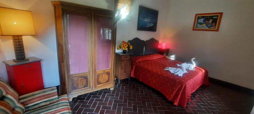 Postel nebo postele na pokoji v ubytování VECCHIO MULINO FONTONA Ortensia