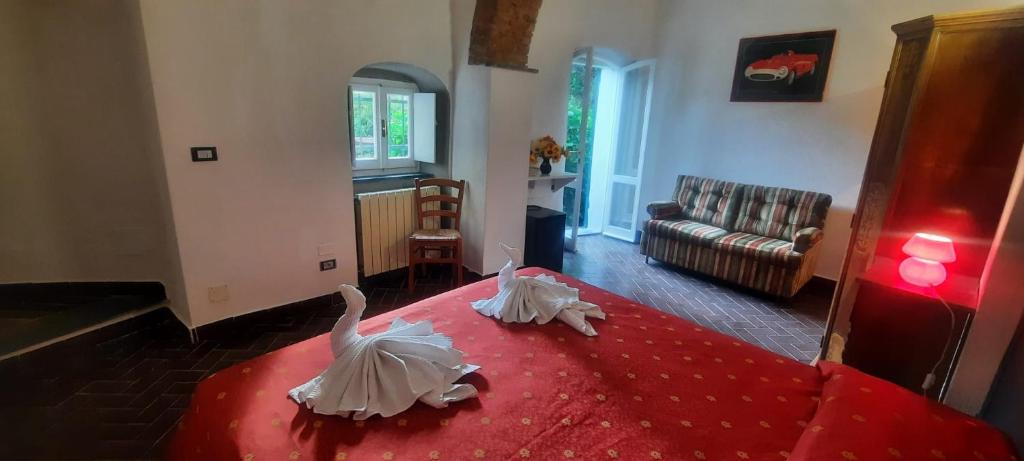 Postel nebo postele na pokoji v ubytování VECCHIO MULINO FONTONA Ortensia