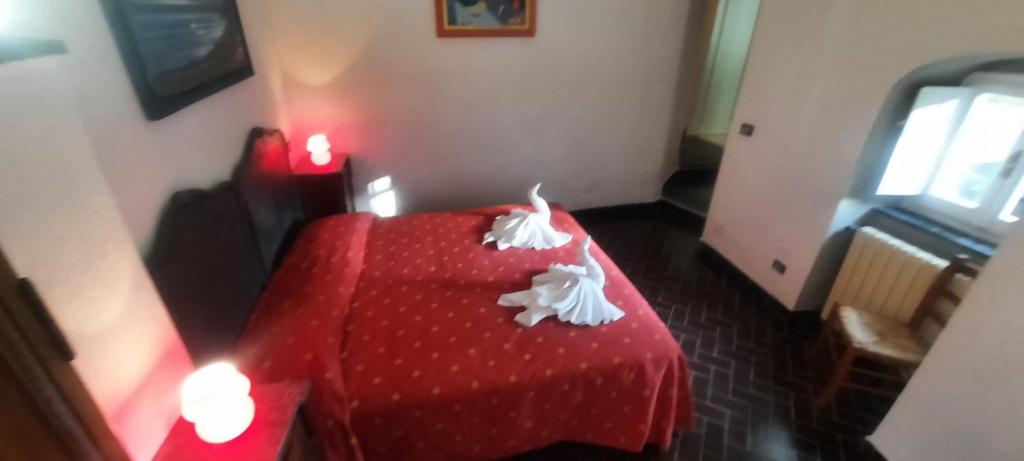 Postel nebo postele na pokoji v ubytování VECCHIO MULINO FONTONA Ortensia