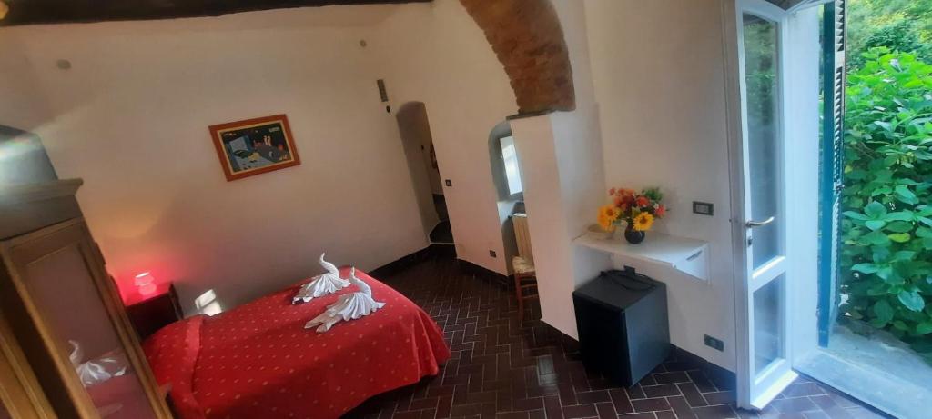 Postel nebo postele na pokoji v ubytování VECCHIO MULINO FONTONA Ortensia