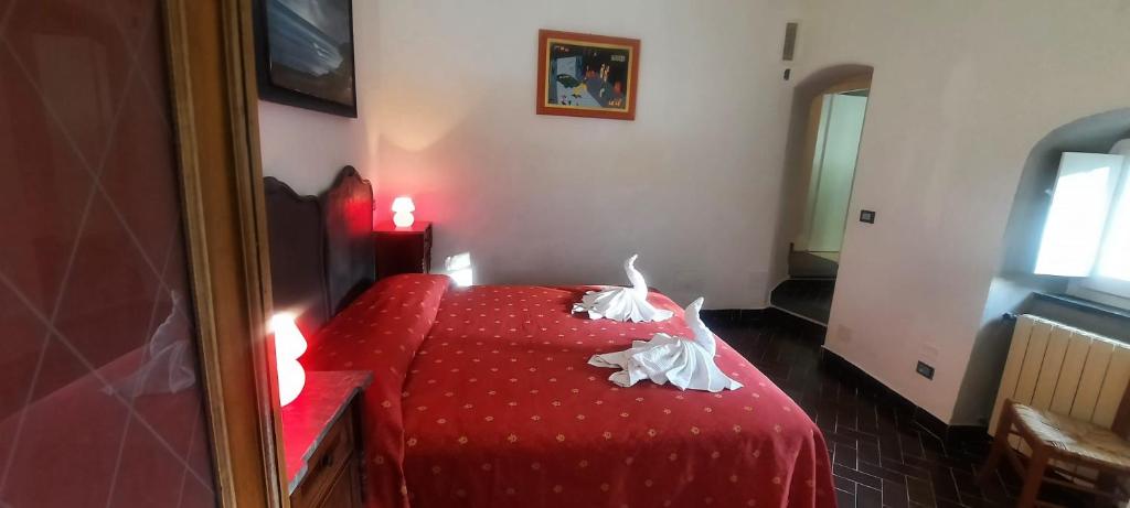 Postel nebo postele na pokoji v ubytování VECCHIO MULINO FONTONA Ortensia