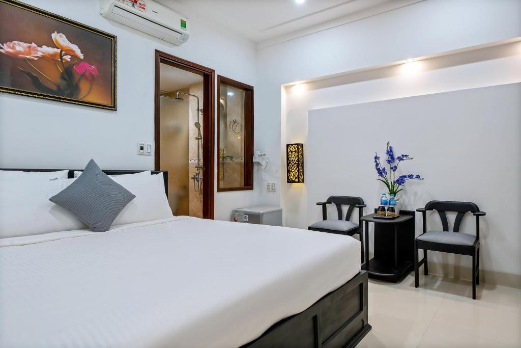 Postel nebo postele na pokoji v ubytování 1 Stop Dory Hotel
