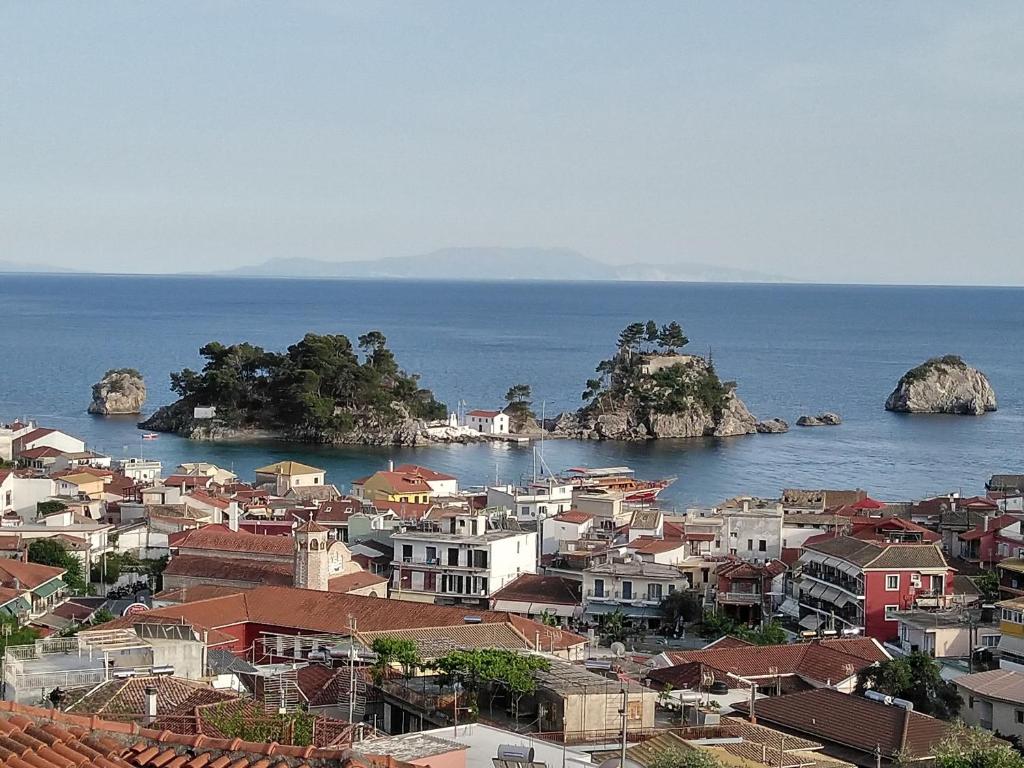 a view of a city and the ocean at Studios Spiros Parga in Parga